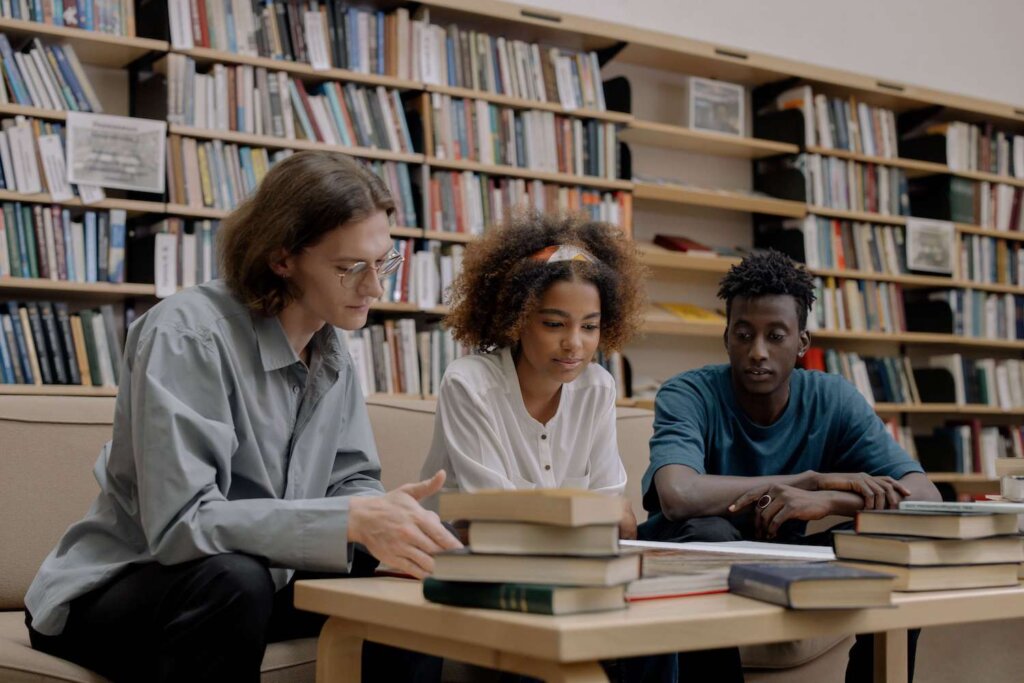 Students at table reading research